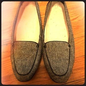 Black and white dress shoes, flats.